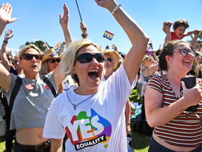 Supporters of the same-sex marriage "Yes" vote gather to celebrate the announcement in a Sydney park on Nov. 15, 2017.