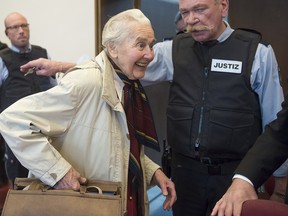 In this Nov. 23, 2017 file photo Ursula Haverbeck, accused of hate speech, arrives in the court room of the District Court in Detmold for a appeal hearing, Germany.