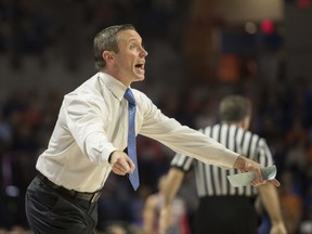 Florida head coach Mike White yells instructions to his team during the first half of an NCAA college basketball game against Gardner-Webb in Gainesville, Fla., Monday, Nov. 13, 2017. (AP Photo/Ron Irby)