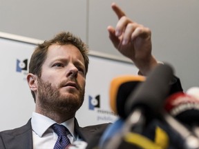 Spokesman of the Brussels Prosecutor's office Gilles Dejemeppe addresses the media in Brussels, Sunday, Nov. 5, 2017. Brussels prosecutors say that ousted Catalan president Carles Puigdemont and four ex-ministers have been taken into custody to start the process of their possible extradition to Spain. (AP Photo/Geert Vanden Wijngaert)