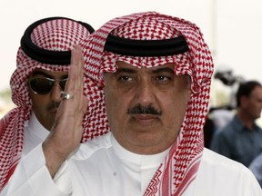 FILE - In this Oct. 23, 2008 file photo, Prince Miteb bin Abdul Aziz, son of Saudi King Abdullah bin Abdul Aziz al-Saud, salutes as leaves the equestrian club following a horse racing competition in Janadriyah in the outskirts of the Saudi capital Riyadh, Saudi Arabia. The king ousted one of the country's highest-level royals from power, relieving Prince Miteb bin Abdullah of his post as head of the National Guard. (AP Photo/Hassan Ammar, File)