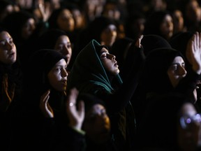 FILE - In this Sept. 30, 2016 file photo, Hezbollah supporters listen to the story of Imam Hussein during activities to mark the ninth of Ashura, a 10-day ritual commemorating the death of Imam Hussein, in a southern suburb of Beirut, Lebanon. The Lebanese militant group Hezbollah has been at the center of the recent crisis that has gripped Lebanon and rattled a region already rife with conflict. (AP Photo/Hassan Ammar, File)