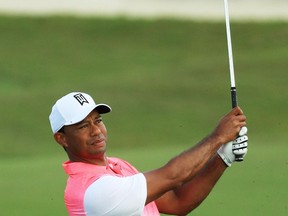 Tiger Woods plays a shot during the pro-am event at the Hero World Challenge in Nassau, Bahamas, on Nov. 29.
