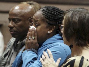 FILE - In this Friday Nov. 3, 2017 file photo, Katrina Johnson becomes emotional at the South Lee County Courthouse in Keokuk, Iowa after the jury returned a guilty verdict for Jorge Sanders-Galvez in the death of Johnson's transgender child, 16-year-old Kedarie Johnson. At least 25 transgender Americans have been homicide victims as of mid-November 2017, the highest annual total this decade, according to advocacy groups that have been monitoring the grim phenomenon and seeking ways to reduce the toll. (John Lovretta/The Hawk Eye via AP, Pool)