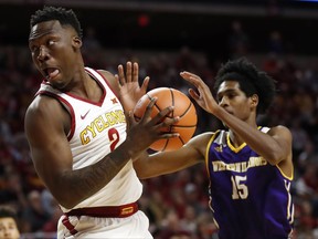 Iowa State forward Cameron Lard, left, drives to the basket past Western Illinois guard Dalan Ancrum, right, during the first half of an NCAA college basketball game, Saturday, Nov. 25, 2017, in Ames, Iowa. (AP Photo/Charlie Neibergall)