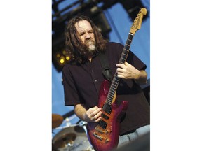FILE - In this July 24, 2004 file photo, Boston lead singer and guitarist Brad Delp performs at the Outdoor Star Arena at Ameristar Casino and Hotel in Council Bluffs, Iowa. Fans of the rock band Boston can get more than a feeling at an upcoming auction - they can get their hands on the personal belongings of Delp. Delp's concert grand piano, an electric guitar, silver glitter platform stage shoes and even his New Hampshire driver's license are among the items for sale by Boston-based RR Auction starting Dec. 7, 2017. (Ben DeVries /The Daily Nonpareil via AP, File)
