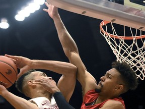 Washington State guard Arinze Chidom goes in for a layup as Seattle's Jordan Hill attempts to block the shot during the first half of an NCAA college basketball game Wednesday, Nov. 15, 2017, in Pullman, Wash. (Pete Caster/The Lewiston Tribune via AP)