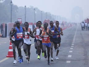 Participants run during the Delhi Half Marathon in New Delhi, India, Sunday, Nov. 19, 2017. Ethiopia's Birhanu Legese and Almaz Ayana won the men's and women's elite categories, respectively. (AP Photo/Oinam Anand)