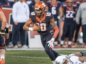 Illinois quarterback Cam Thomas (10) runs the ball during the first quarter of an NCAA college football game against Northwestern Saturday, Nov. 25, 2017 at Memorial Stadium in Champaign, Ill. (AP Photo/Bradley Leeb)