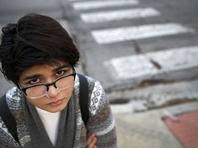 In this Friday, Nov. 3, 2017, photo, Chicago high school senior Hira Zeeshan poses for a portrait in the West Ridge neighborhood of Chicago. Zeeshan, a Pakistani Muslim immigrant, said she's been affected personally by the anti immigrant rhetoric that is on the rise in the nation's schools. (AP Photo/Charles Rex Arbogast)