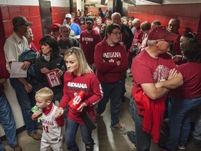 Hoosier fans got to see parts of the Simon Skjodt Assembly Hall that they normally don't get to see during an evacuation of the hall before the Indiana University of Indianapolis men's basketball game in Bloomington, Ind., Sunday, Nov. 5, 2017. A severe storm brought a tornado warning to the area which caused officials to move fans to the safe areas in the below ground hallways. (Chris Howell/The Herald-Times via AP)