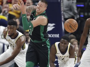 Boston Celtics' Daniel Theis (27) has the basketball stripped by Indiana Pacers' Darren Collison (2) during the first half of an NBA basketball game, Saturday, Nov. 25, 2017, in Indianapolis. (AP Photo/Darron Cummings)
