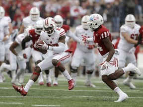 Wisconsin wide receiver Quintez Cephus (87) makes a catch against Indiana's Andre Brown Jr. (14) during the first half of an NCAA college football game, Nov. 4, 2017, in Bloomington, Ind. (AP Photo/Darron Cummings)
