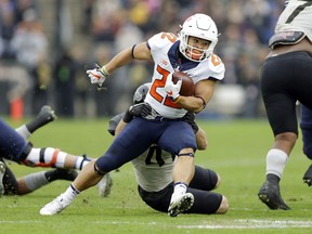 Illinois running back Kendrick Foster (22) is tackled by Purdue safety Jacob Thieneman (41) during the first half of an NCAA college football game in West Lafayette, Ind., Saturday, Nov. 4, 2017. (AP Photo/Michael Conroy)