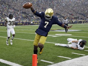 Notre Dame quarterback Brandon Wimbush scores a touchdown during the first half of an NCAA college football game against Wake Forest, Saturday, Nov. 4, 2017, in South Bend, Ind. (AP Photo/Nam Y. Huh)