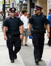 Toronto police officers patrol on Yonge Street.