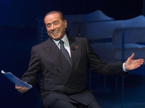 Former Italian Prime Minister and leader of "Forza Italia" party, Silvio Berlusconi, gestures during the recording of Rai TV program 'Porta a porta', in Rome Thursday,  Nov. 16, 2017.