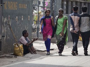 In this Monday, Nov. 13, 2017 photo, an Indian man seeks alms at a street in Hyderabad, India. Authorities in this southern Indian city are rounding up beggars ahead of a visit by Ivanka Trump. Over the past week, more than 200 beggars have been transported to separate male and female shelter homes located on the grounds of two city prisons. Officials say the drive against begging was launched because two international events are taking place in the city _ the Global Entrepreneurship Summit and the World Telugu Conference in December. (AP Photo /Mahesh Kumar A.)