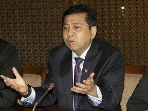 FILE - In this  July 18, 2017, file photo, Indonesian House Speaker Setya Novanto gestures during a press conference in Jakarta, Indonesia. Indonesia's anti-graft commission said Thursday, Nov. 16, 2017 it will declare Novanto a fugitive if he doesn't turn himself in after being accused of involvement in the theft of $170 million of public funds. (AP Photo/Tatan Syuflana, File)