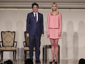 Ivanka Trump, right, the daughter and advisor to U.S. President Donald Trump and Japanese Prime Minister Shinzo Abe stand together at World Assembly for Women: WAW! 2017 conference in Tokyo Friday, Nov. 3, 2017.