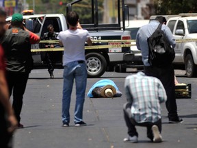 The body of slain journalist Javier Valdez, co-founder of the newspaper Riodoce and a legendary chronicler of drug trafficking in Sinaloa state, in Culiacan, Mexico, lies in the street on May 15, 2017.