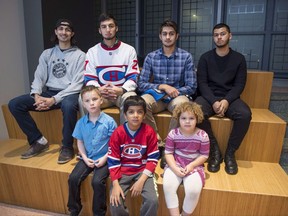 Yusuf Ahmed, 19, top left to right, Saif-Ullah Khan, 17, Aadam Ahmed 18, Adam Ahmed, 19, bottom left to right, David Matthews, 6, Adam Ahmed, 8, Alia Mohamed, 4, are shown in Ottawa, as the families of children and youth who keep getting stopped because their names match ones on security lists meet, on Sunday, Nov. 5, 2017. THE CANADIAN PRESS/Justin Tang