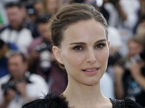 FILE - In this May 17, 2015 file photo, Natalie Portman poses for photographers during a photo call at the 68th international film festival, Cannes, southern France. On Tuesday, Nov. 7, 2017, Natalie Portman was awarded Israel's 2018 Genesis Prize, a $1 million recognition that is widely known as the "Jewish Nobel Prize." Organizers of the prize announced Tuesday that they were recognizing the Oscar-winning actress for her commitment to social causes and deep connection to her Jewish and Israeli roots. (AP Photo/Lionel Cironneau, File)