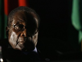 FILE - In this Aug. 17 2008 file photo Zimbabwean President Robert Mugabe is seen at the closing ceremony of the 28th Southern African Development Community summit of heads of state and government, in Johannesburg, South Africa. Mugabe seemed almost untouchable for much of his nearly four-decade rule. Shrewd and ruthless, he managed to stay in power despite advancing age, growing opposition, international sanctions and the dissolving economy of a once-prosperous African nation. Now, the apparent abrupt end of the Mugabe era is launching Zimbabwe into the unknown. It's a humbling close to the career of a man who crushed dissent or sidelined opponents after leading Zimbabwe since 1980. (AP Photo/Jerome Delay, File)