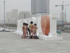 A group of Czech tourists dressed in swimsuits made famous by TV and film character Borat in Atana, Friday Nov. 10, 2017. The group of six Czech tourists who visited Kazakhstan dressed up in  the skimpy swimsuits have reportedly been detained by authorities in the central Asian country's capital Astana.