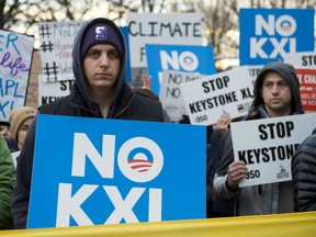 Opponents of the Keystone XL and Dakota Access pipelines hold a rally as they protest President Donald Trump's executive orders advancing their construction