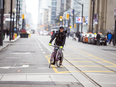 A cyclist seems to have the road to themselves during the first work day of the King Street pilot project on Nov. 13.