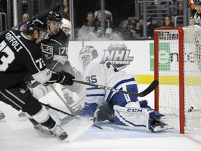 Tyler Toffoli of the Los Angeles Kings redirects a shot past Toronto Maple Leafs' goaltender Curtis McElhinney during NHL action Thursday night in Los Angeles. The Kings were 5-3 winners.