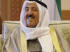 FILE- In this Dec. 8, 2014 file photo, Emir of Kuwait Sheik Sabah Al Ahmad Al Sabah attends a meeting with U.S. Secretary of Defense Chuck Hagel, in Kuwait City. According to a report on the state-run KUNA news agency on Wednesday, Nov. 22, 2017, Sheik Sabah, Kuwait's 88-year-old leader, has been admitted to hospital with a "cold." (AP Photo/Mark Wilson, File)