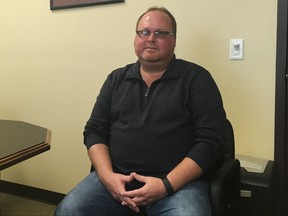 In this Nov. 9, 2017 photo, Elwood Caudill sits at the Rowan County Property Valuation Administrators office in Morehead, Ky. Caudill says he plans to run for county clerk against Kim Davis, who caused an uproar in 2015 when she refused to issue marriage licenses because of her opposition to same-sex marriage. Caudill ran against Davis in 2014 in the Democratic primary, but lost by 23 votes. In 2018, Caudill will run as a Democrat while Davis has switched parties to become a Republican. (AP Photo/Adam Beam)