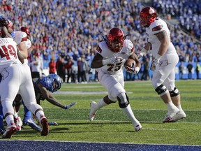 Louisville running back Dae Williams runs to the end zone for a touchdown during the first half of an NCAA college football game against Kentucky, Saturday, Nov. 25, 2017, in Lexington, Ky. (AP Photo/David Stephenson)