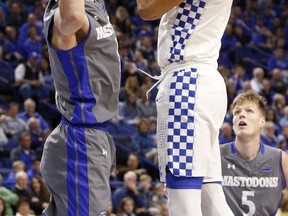 Kentucky's Nick Richards, right, shoots while defended by Fort Wayne's Dylan Carl during the first half of an NCAA college basketball game, Wednesday, Nov. 22, 2017, in Lexington, Ky. (AP Photo/James Crisp)