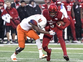 Louisville wide receiver Seth Dawkins (5) is hit by Syracuse defensive back Juwan Dowels (9) during the first half of an NCAA college football game, Saturday, Nov. 18, 2017, in Louisville, Ky. (AP Photo/Timothy D. Easley)
