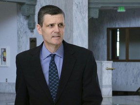 FILE - In this April 26, 2016 file photo, Washington State Auditor Troy Kelley leaves the federal courthouse in Tacoma, Wash. Kelley, whose federal fraud trial last year ended with an acquittal on one count and a deadlocked jury on more than a dozen others, will be in a courtroom once again this week as prosecutors try him a second time. And this time, newly recovered emails dating to 2003 could shed light on whether he was entitled to pocket the roughly $3 million the government says he stole when he ran a real-estate services business during the height of last decade's housing boom. (AP Photo/Ted S. Warren, File)