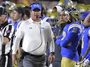 UCLA head coach Jim Mora walks the sideline during the first half of an NCAA college football game against Southern California, Saturday, Nov. 18, 2017, in Los Angeles. (AP Photo/Mark J. Terrill)