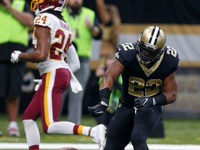 New Orleans Saints running back Mark Ingram (22) his touchdown in front of Washington Redskins cornerback Josh Norman (24) in the first half of an NFL football game in New Orleans, Sunday, Nov. 19, 2017. (AP Photo/Butch Dill)