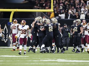 New Orleans Saints mob kicker Wil Lutz after he hit the game winning field goal during overtime of an NFL football game against the Washington Redskins in New Orleans, Sunday, Nov. 19, 2017. The Saints won 34-31.(AP Photo/Rusty Costanza)