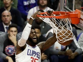 Los Angeles Clippers center Willie Reed dunks against the Philadelphia 76ers during the first half of an NBA basketball game in Los Angeles, Monday, Nov. 13, 2017. (AP Photo/Chris Carlson)