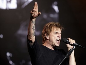 FILE - In this June 3, 2017 file photo singer Campino performs on stage with his band "Die Toten Hosen" at the music festival Rock am Ring in Nuerburg, Germany. Campino one of Germany's most famous rock stars is throwing his support behind German Chancellor Angela Merkel, calling on her to "hang in there," after talks about forming a new government collapsed on the weekend. (Thomas Frey/dpa via AP, file)