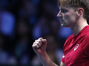 Belgium's David Goffin clenches his fist after winning a point as he plays France's Lucas Pouille during their Davis Cup final single match at the Pierre Mauroy stadium in Lille, northern France, Friday, Nov. 24, 2017. (AP Photo/Michel Spingler)