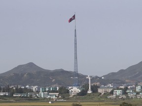 In this Sept. 28, 2017, photo, a North Korean flag flutters in the wind atop a 160-meter (525-foot) tower in the North's Kijong-dong village near the truce village of Panmunjom in the Demilitarized Zone which has separated the two Koreas since the Korean War, in Paju, South Korea. (AP Photo/Lee Jin-man)