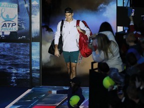 Roger Federer of Switzerland arrives to play his singles tennis match against Jack Sock of the United States at the ATP World Finals at the O2 Arena in London, Sunday, Nov. 12, 2017. (AP Photo/Kirsty Wigglesworth)