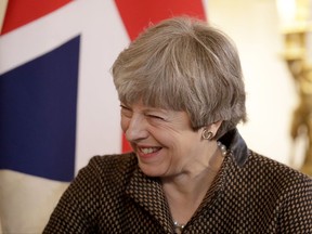 British Prime Minister Theresa May speaks to Turkey's Prime Minister Binali Yildirim during their meeting at 10 Downing Street in London, Monday, Nov. 27, 2017. (AP Photo/Matt Dunham, Pool)