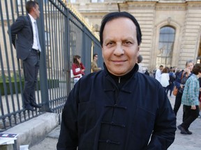 FILE - A Friday, Sept. 26, 2014 file photo of Tunisian-born fashion designer Azzedine Alaia arriving at Christian Dior's Spring/Summer 2015 ready-to-wear fashion collection presented in Paris, France. Alaia, an iconoclast whose clingy dresses marked the 1980s and who dressed famous women from Hollywood to the White House, has died at age 77. The French Haute Couture Federation announced Alaia's death on Saturday, Nov. 18, 2017, without providing details. (AP Photo/Francois Mori, File)