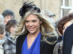 FILE - In this Saturday, Feb. 26, 2011 file photo, Chelsy Davy arrives at the wedding of the Duke and Duchess of Northumberland's eldest daughter Lady Katie Percy to city financier Patrick Valentine at St Michael's Church in Alnwick, England. Prince Harry, who has long been one of Britain's most eligible and wealthiest single men and now engaged to actress Meghan Markle, has had two serious girlfriends in his life, although both seemed uncomfortable with the nonstop press interest in Britain's senior royals. (AP Photo/Scott Heppell, File)