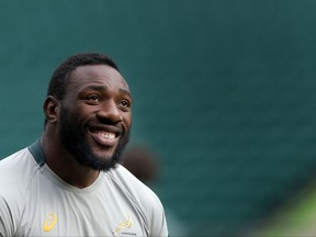 FILE - In this Friday, Oct. 23, 2015 file photo, South Africa's Tendai Mtawarira smiles during a training session at Twickenham Stadium, London. First-choice props Tendai Mtawarira and Coenie Oosthuizen are back for South Africa against Ireland at Lansdowne Road on Saturday, Nov. 11, 2017. (AP Photo/Christophe Ena, file)